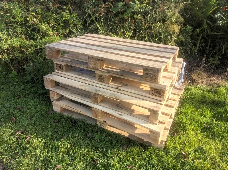 Wooden pallets on my lawn.