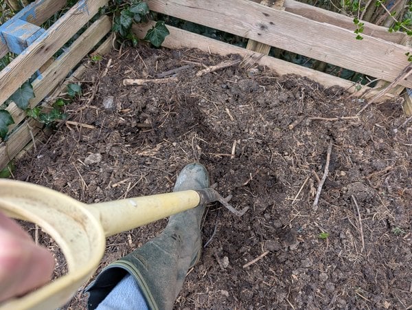 I turn the compost in my pallet bin.