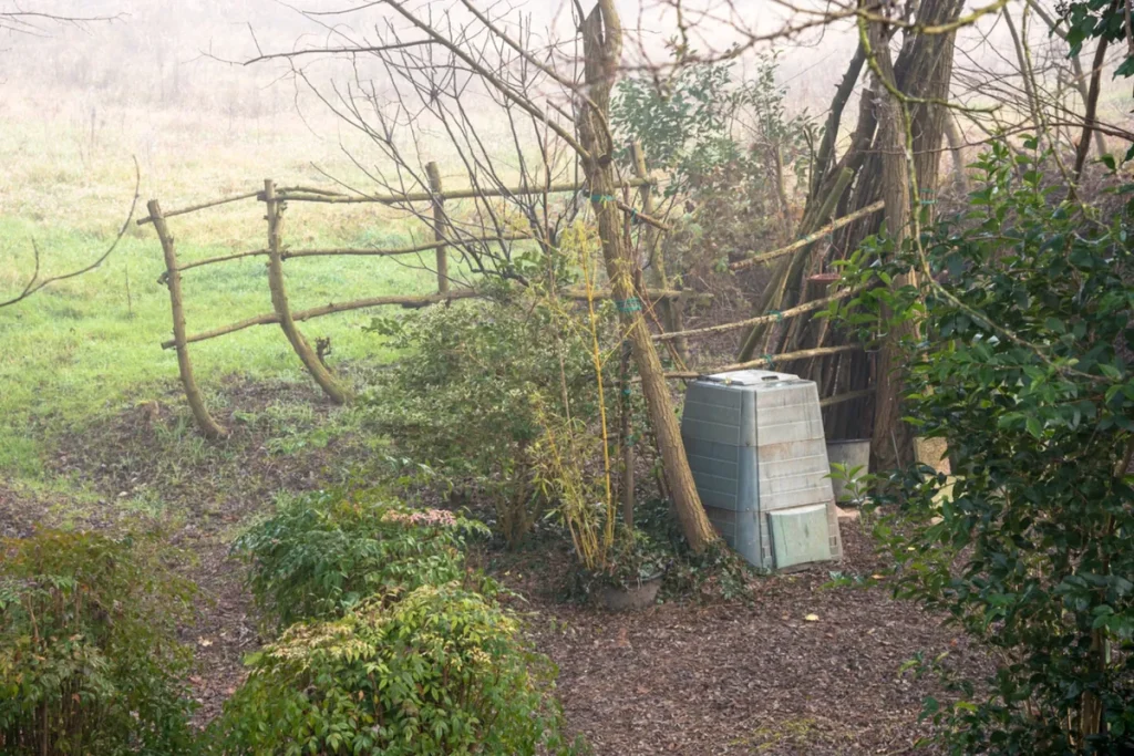Compost bin in a misty garden.