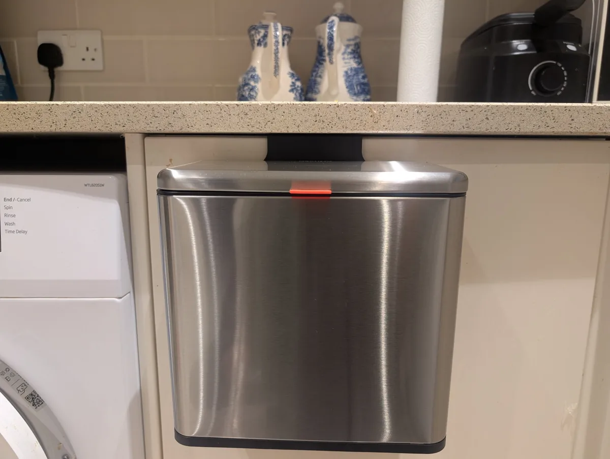 mBillion hanging kitchen compost bin mounted on a cupboard door