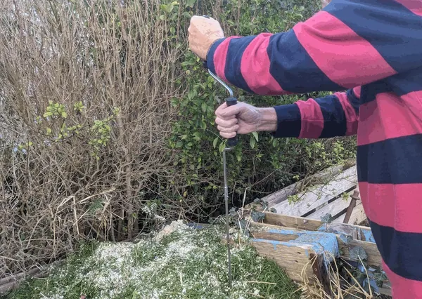 Using the Ejwox on my compost pile.