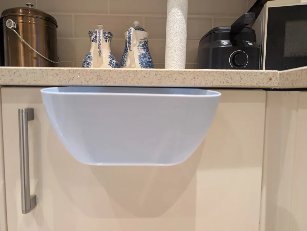 Navaris bin hanging off a cabinet door. 